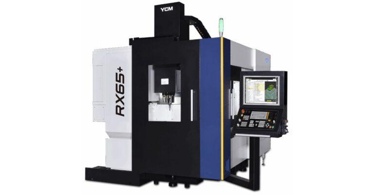 A white-and-black YCM Alliance 5-axis vertical machining center. The model number is displayed on the side as "RX65+".