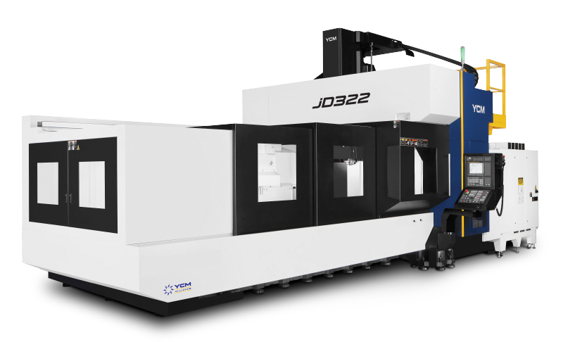 YCM JD322 double-column machining center with a long enclosed work area. Its white body has black doors and a control panel.