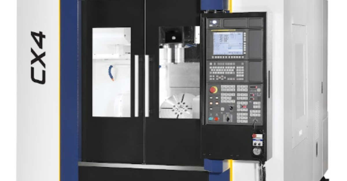 An industrial machine has black doors on the front that open outward. A keyboard and more buttons appear next to the doors.