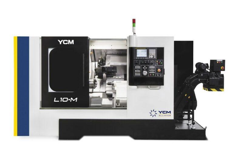A large black and white CNC machine features a large window to see into the machine and a keyboard.
