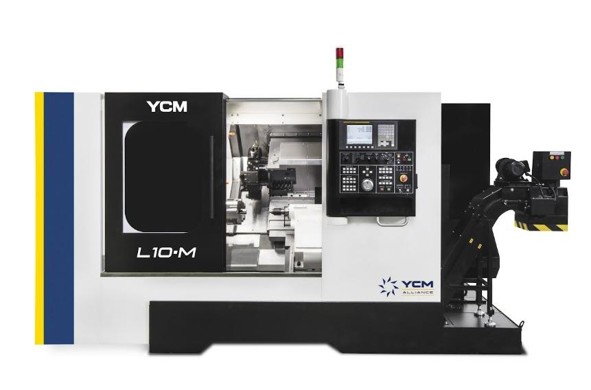 A large black and white CNC machine features a large window to see into the machine and a keyboard.