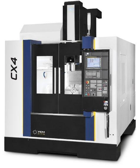 A gray CNC machine features the letters CX and the number four vertically on the side. It has a lot of numbers and a screen.