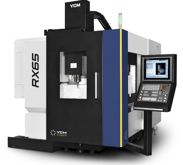 A large blue, gray, and black CNC machine has an attached laptop off to the side and a window to view the machine.